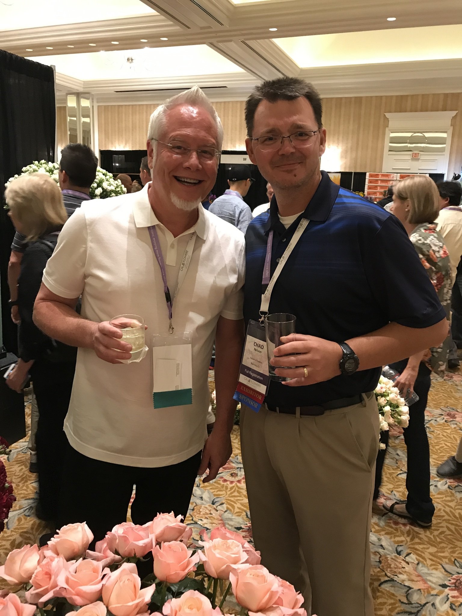 Chad from Eufloria Flowers visits with J Schwanke at the Fun N Sun Convention