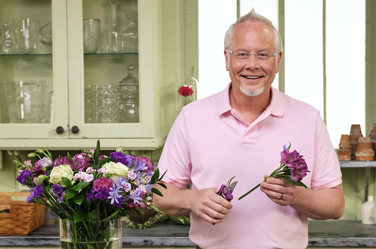 J arranging flowers with his Purple ColorPoint Bypass Pruners from Dramm Lawn and Garden Tools