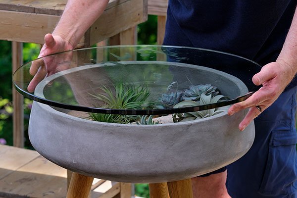Once you've placed your Plants and decorative accessories inside the base- you place your glass top!