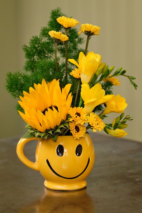 This Vintage Smile Mug- is one of the Novelty Flower Arrangements we used to make in the flower shop- that always made people happy!