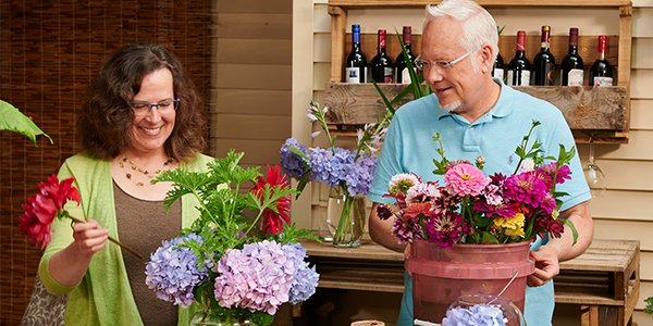 J enjoys sharing the simple pleasure- of arranging flowers for yourself- with his guests on “Life in Bloom”- picture Trina Weller and J Schwanke