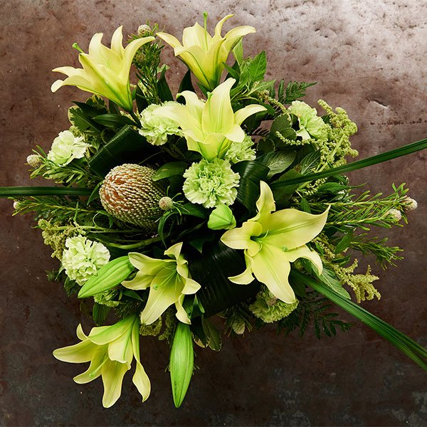 J loves the concept of Foliage First- to provide a structure that supports flowers... he demonstrates this process with this Green Bouquet!