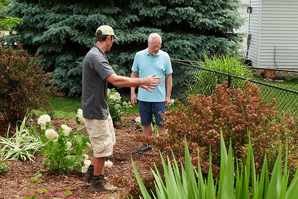 J consults with Mr. Bill Souffrou- on the Water retention and Erosion prevention project featured on this week's Life in Bloom!