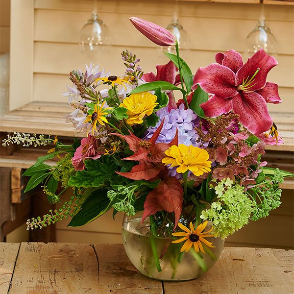J creates an arrangement featuring all things from the Earth- Flowers and Foliage selections- all from his personal garden!