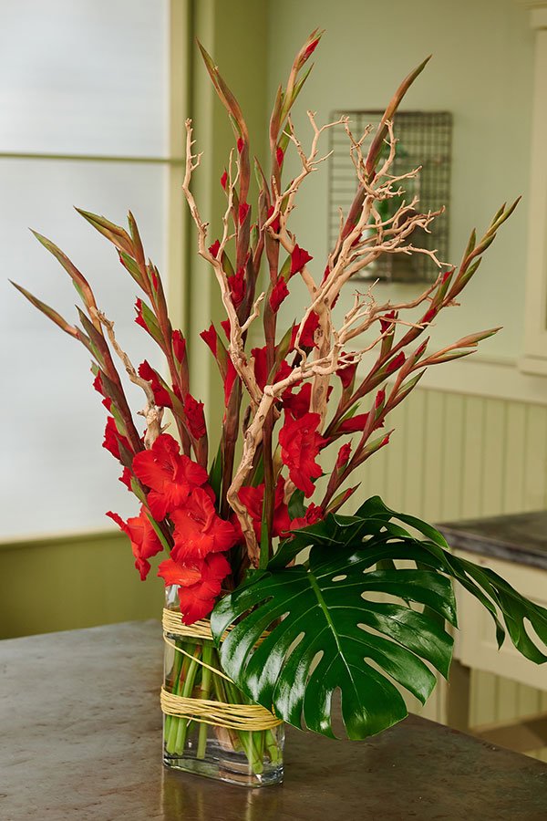 J uses a Manzanita Branch as a support structure in this Vase arrangement with Gorgeous Red Glads!