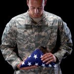 Soldier w folded flag