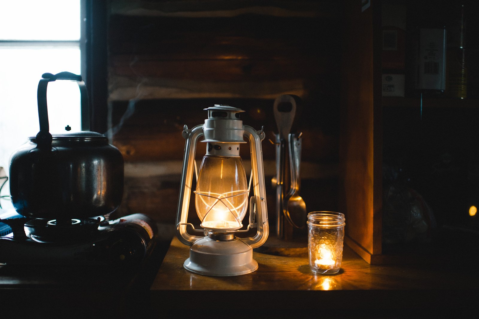 white ikea lantern | winter log cabin photography | ontario travel photography | airbnb near huntsville ontario