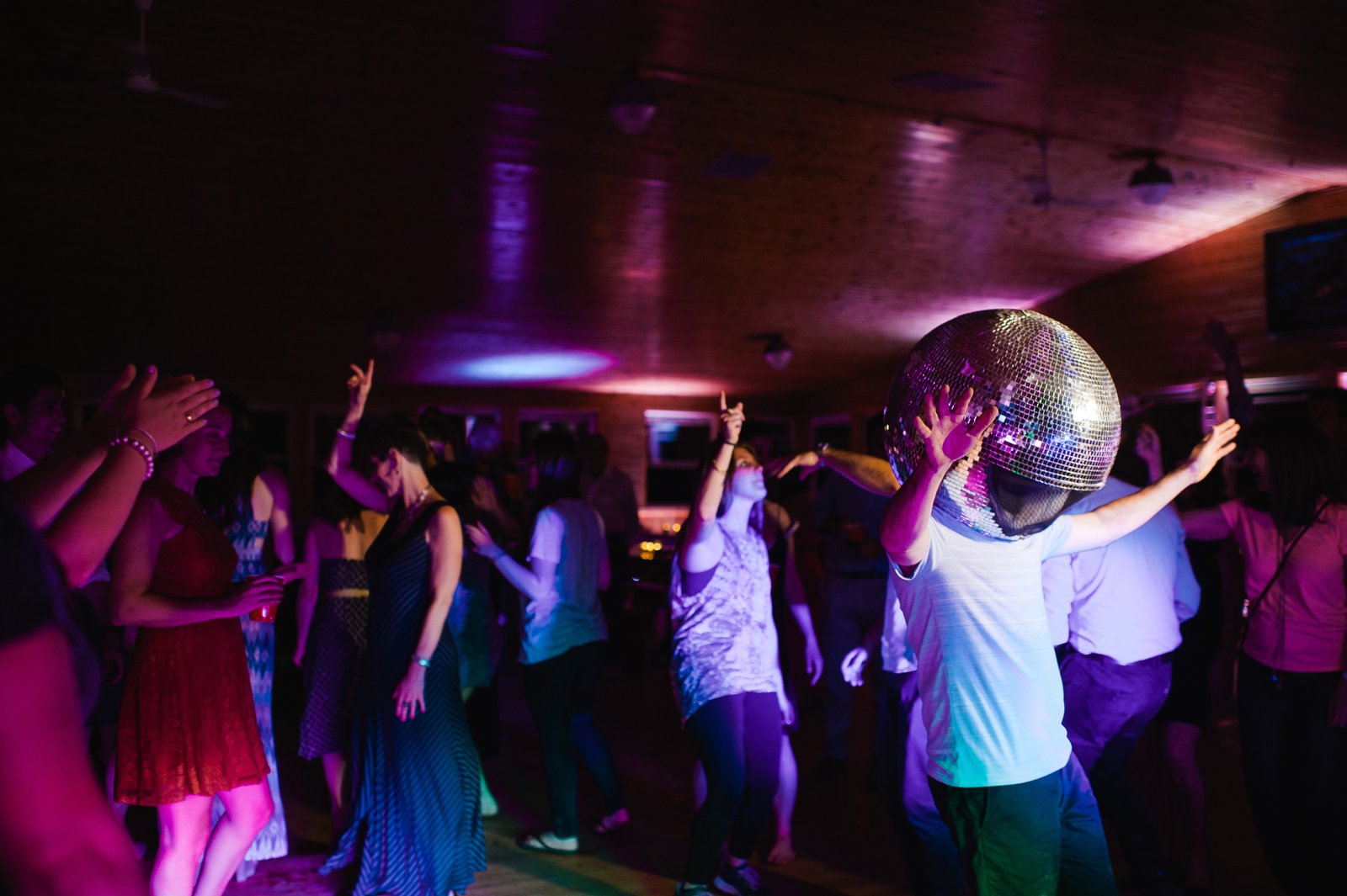discoball man invades the dance floor at this ontario camp wedding | camp timberlane | muskoka wedding photographers