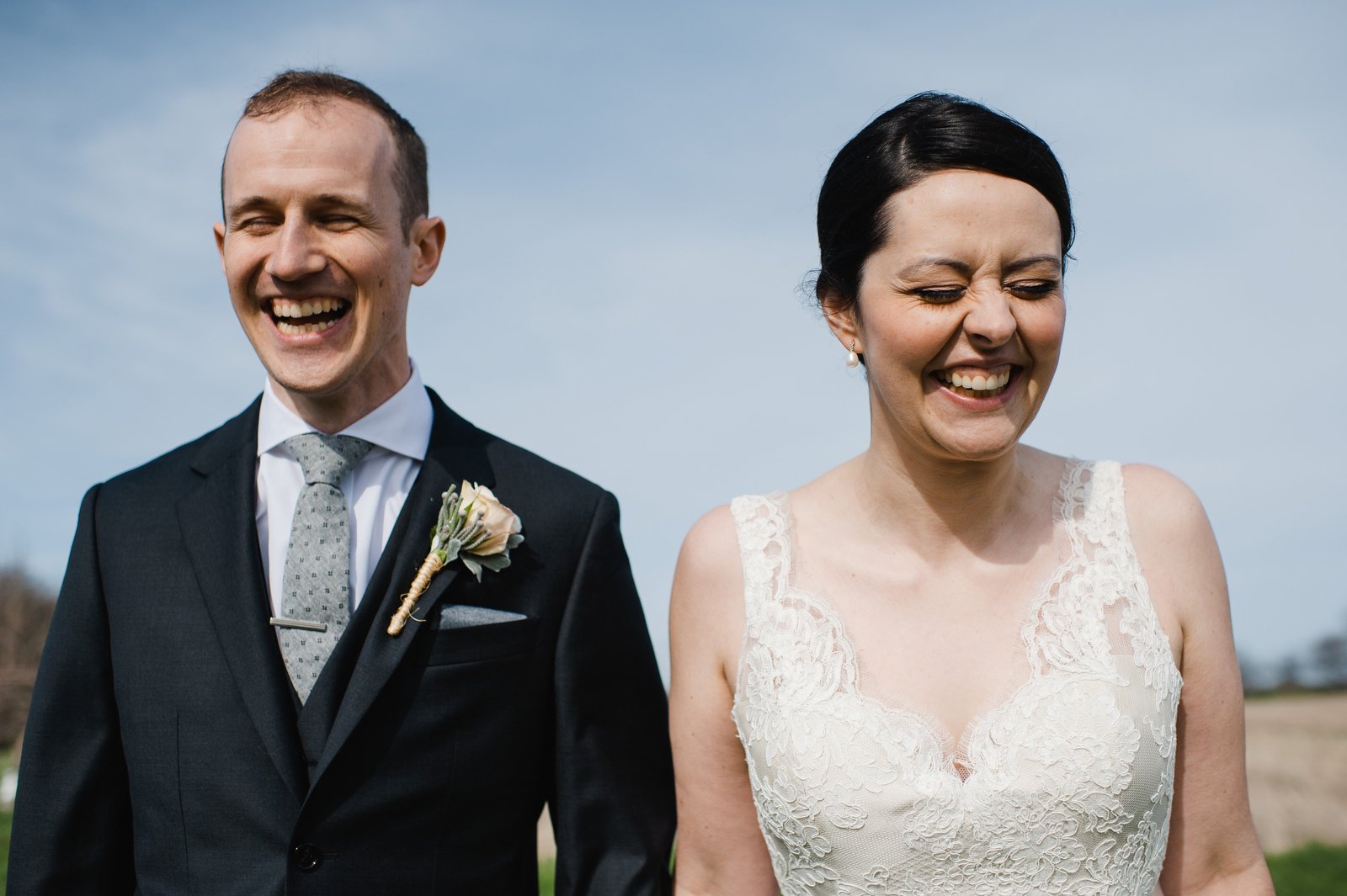 documentary wedding photography | laughing bride and groom | fields on west lake