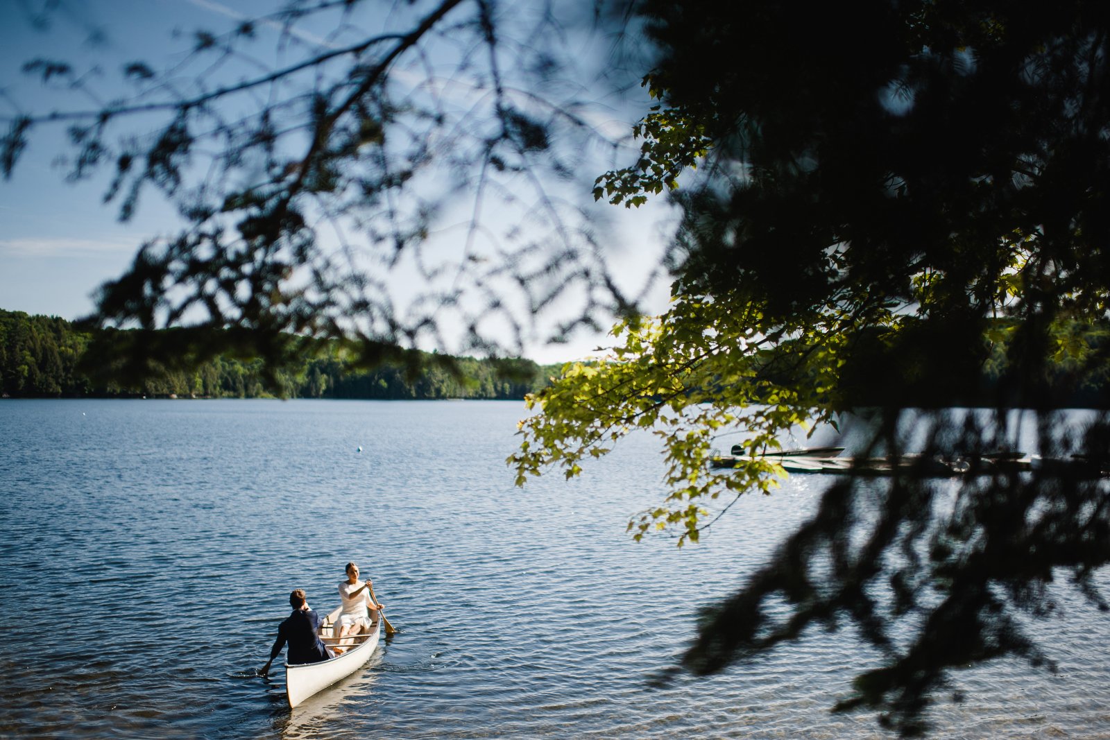 wedding photos in a canoe | ontario summer camp wedding | camp timberlane | muskoka wedding photographers