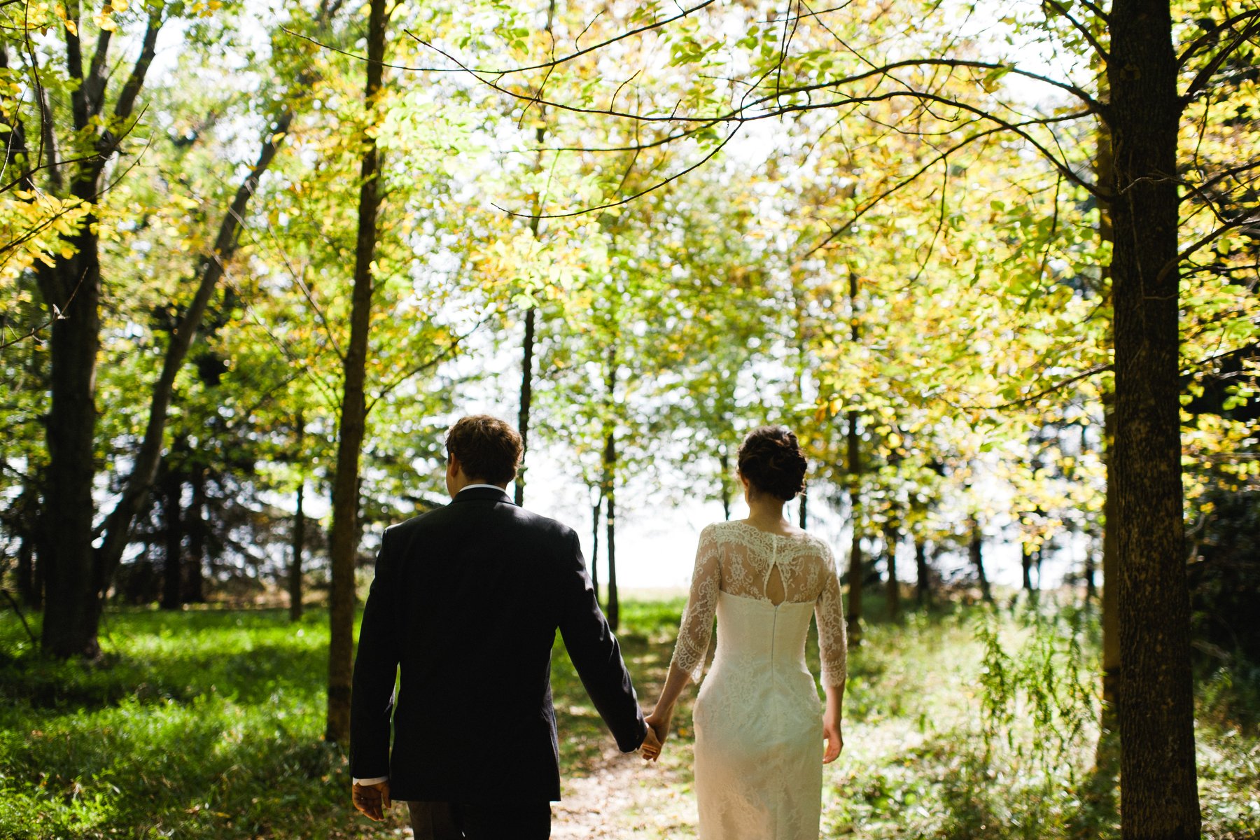 bride and groom strolling in elmira conservation area