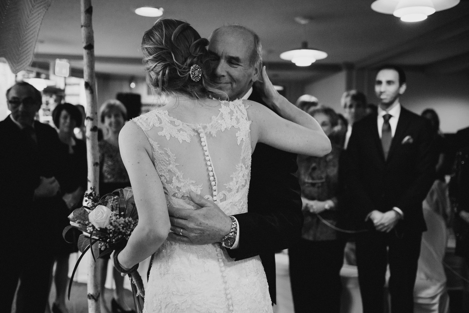 father and daughter embrace before the ceremony