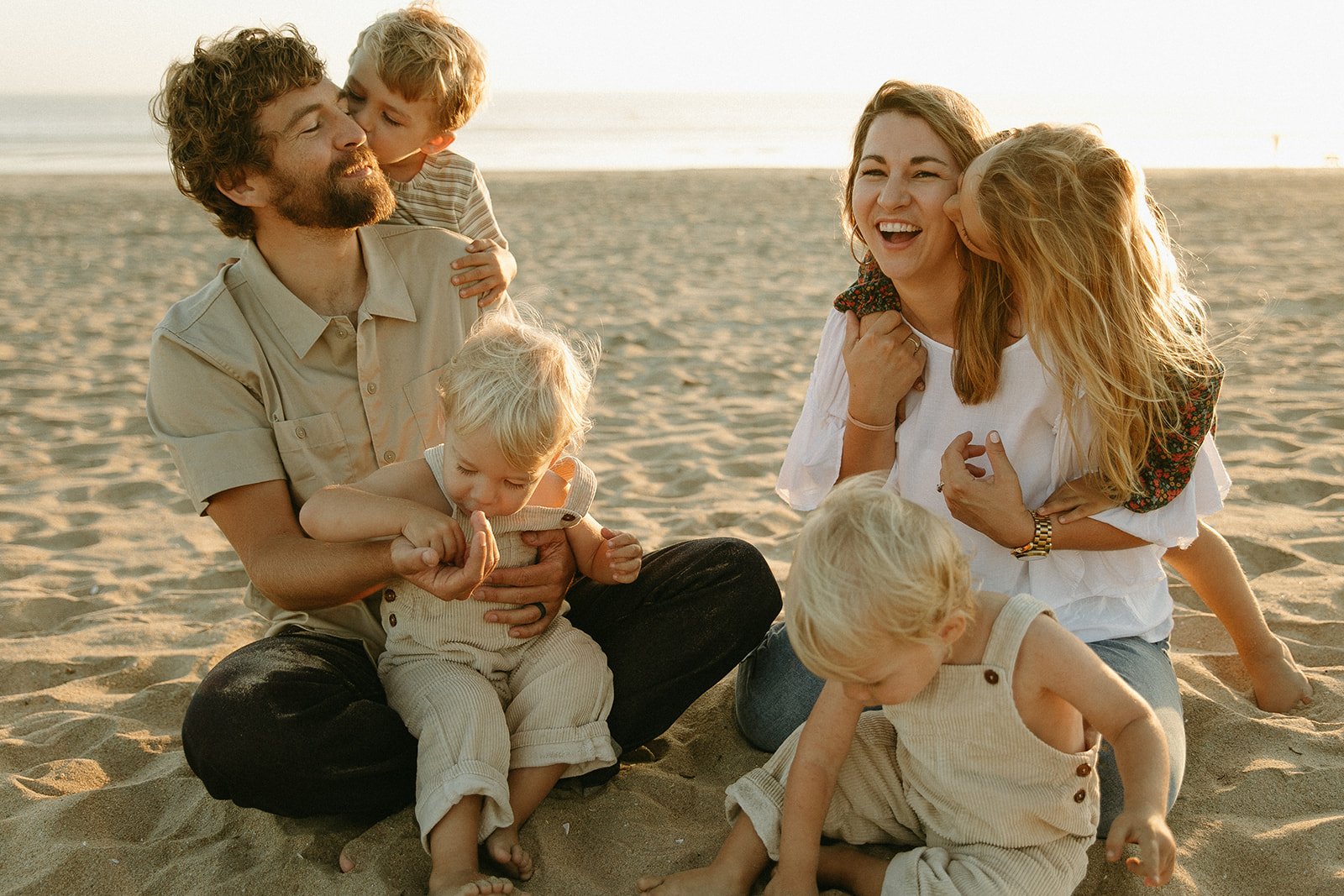 Candid beach family photoshoot at Bolsa Chica State Beach