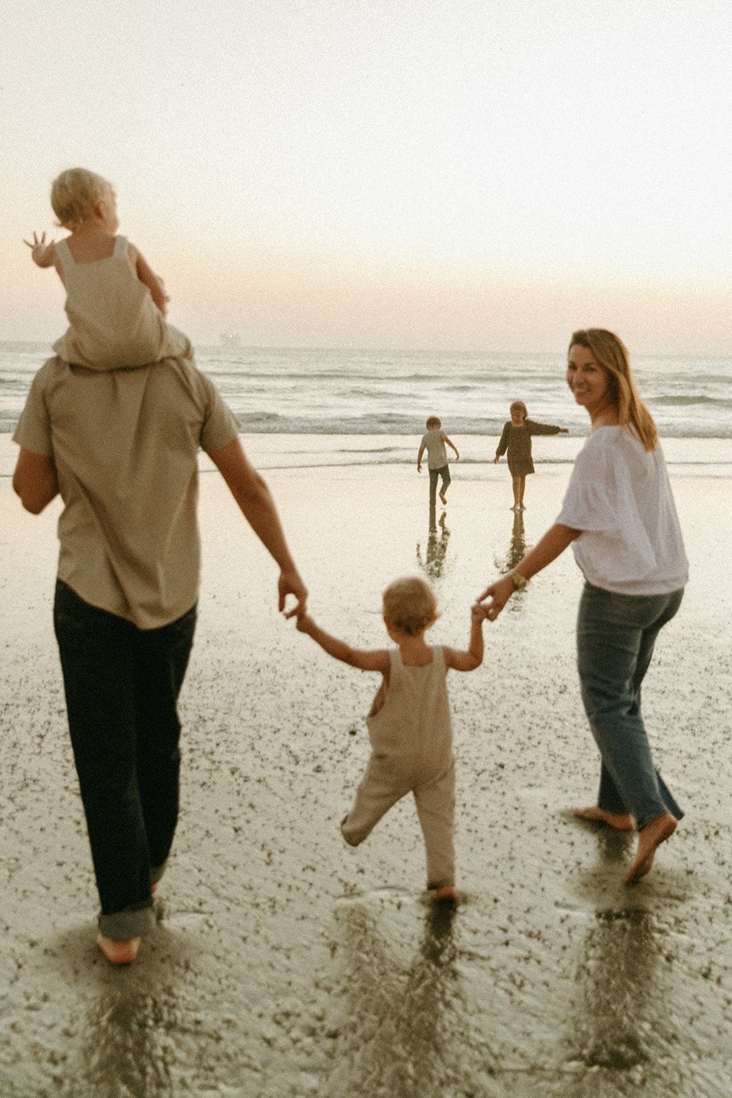 Documentary style family photoshoot on a beach