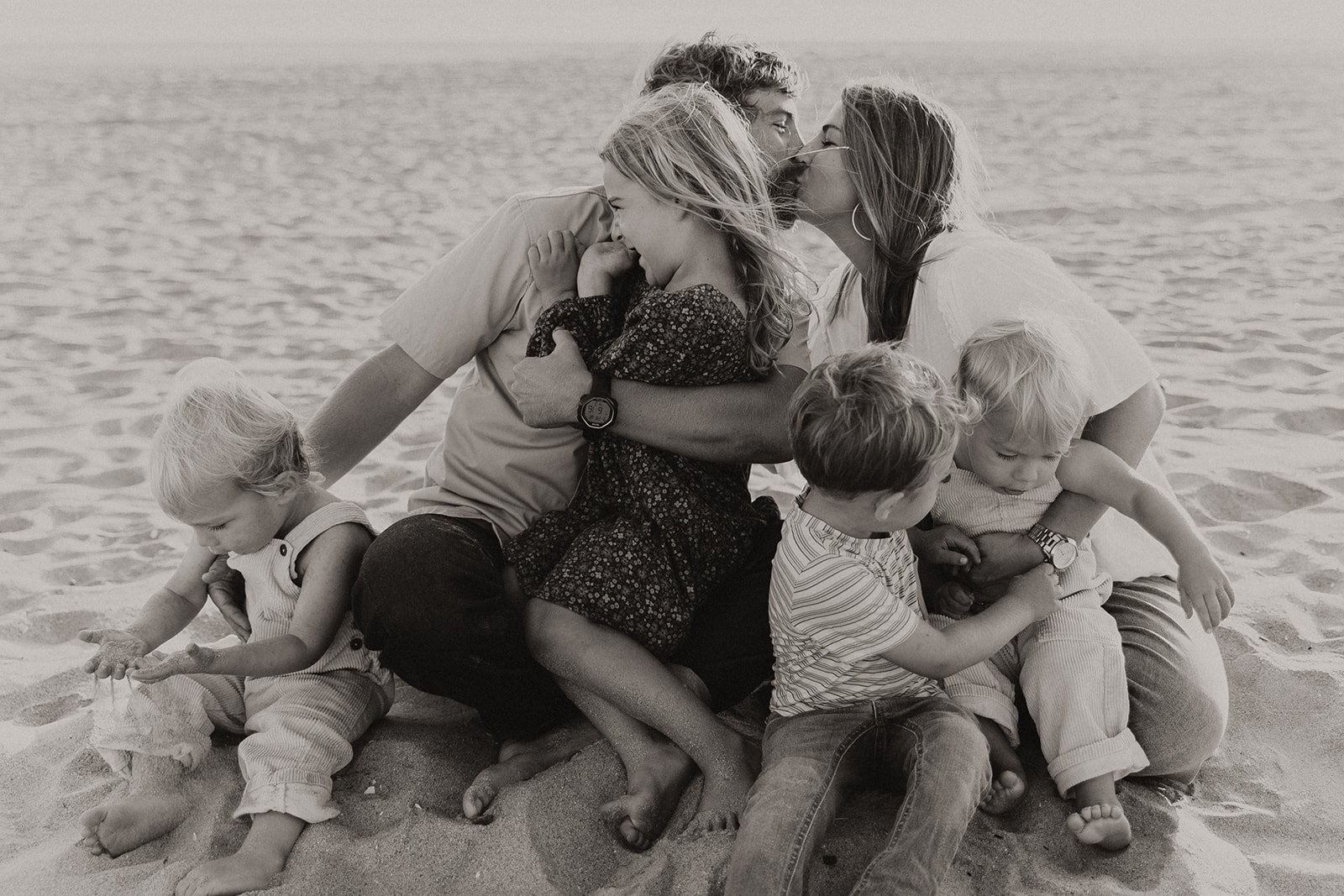 Documentary style family photoshoot on a beach