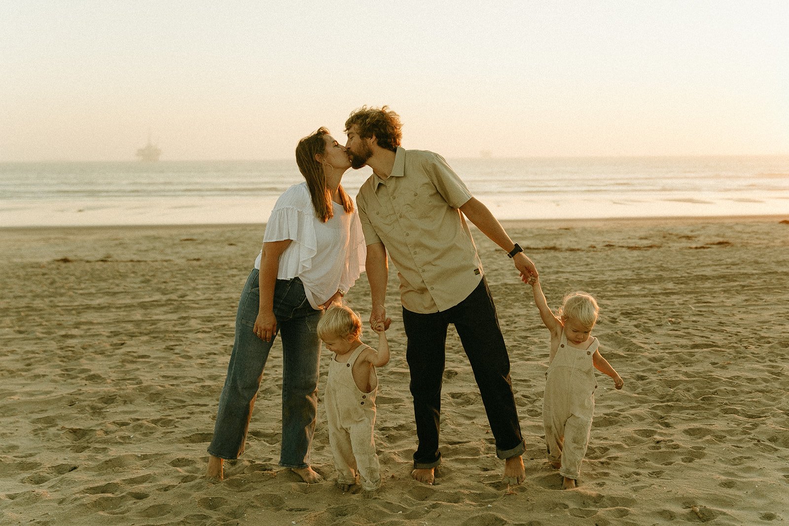 Candid beach family photoshoot at Bolsa Chica State Beach