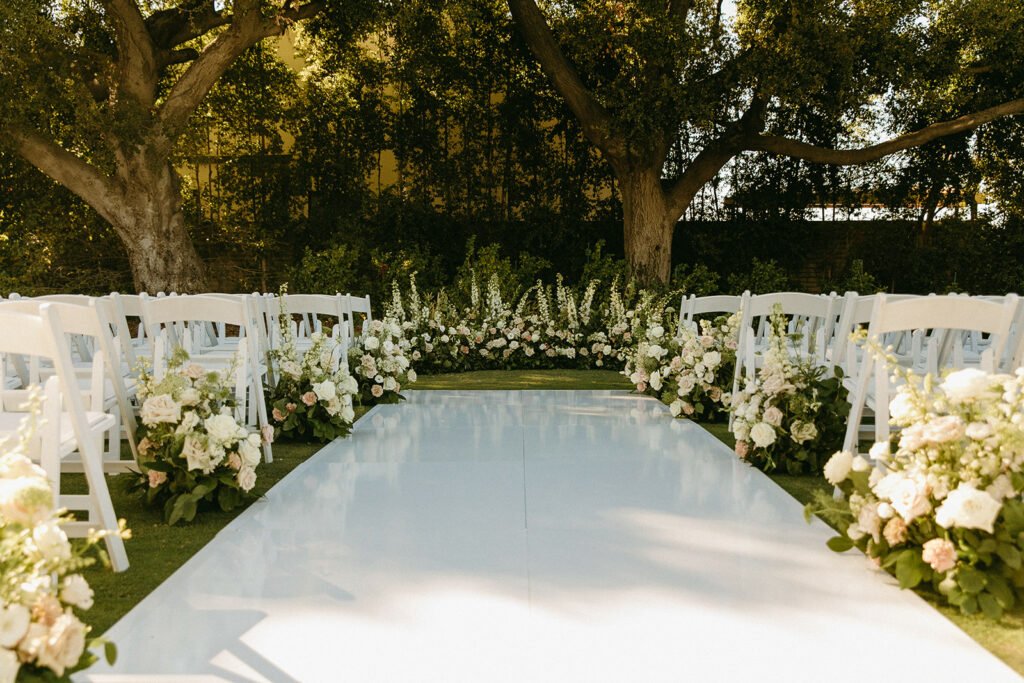 Romantic wedding ceremony details and floral arrangements