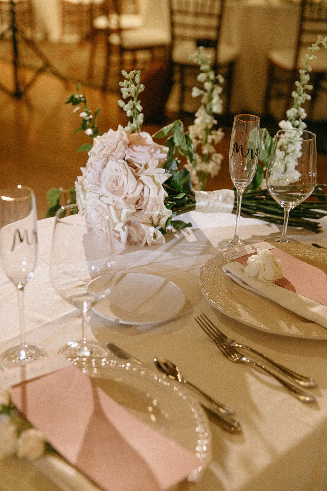 Romantic wedding reception details and floral arrangements