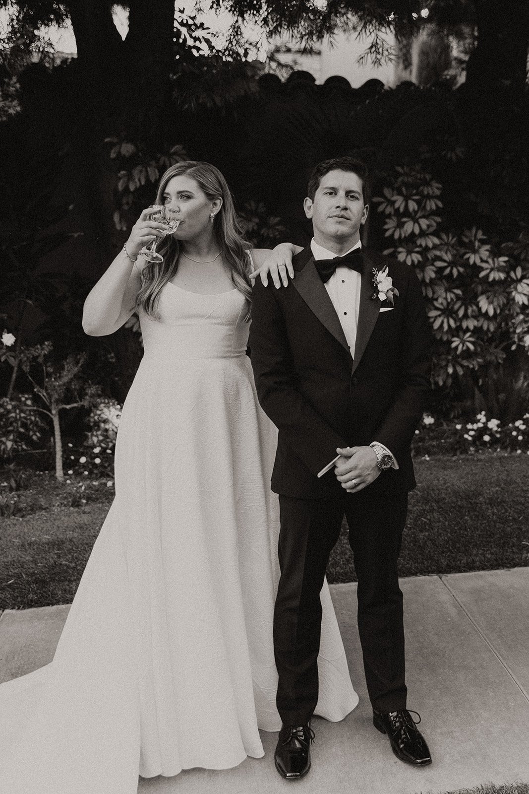 Black and white photo of bride and groom portraits for an outdoor wedding