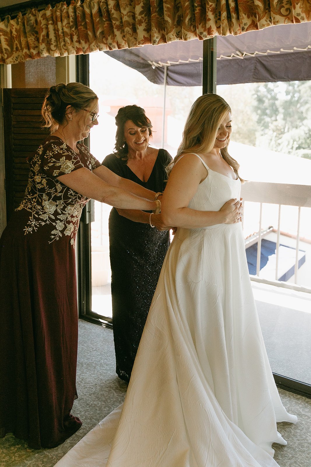 Bride getting ready with family