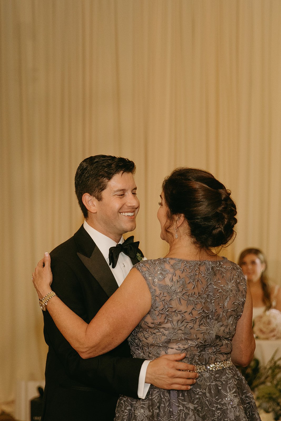 Groom dancing with his mom during wedding reception
