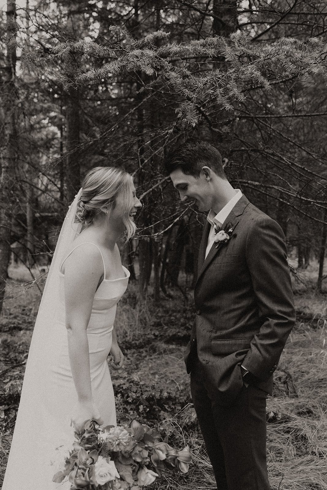 Black and white photo of first look with bride and groom