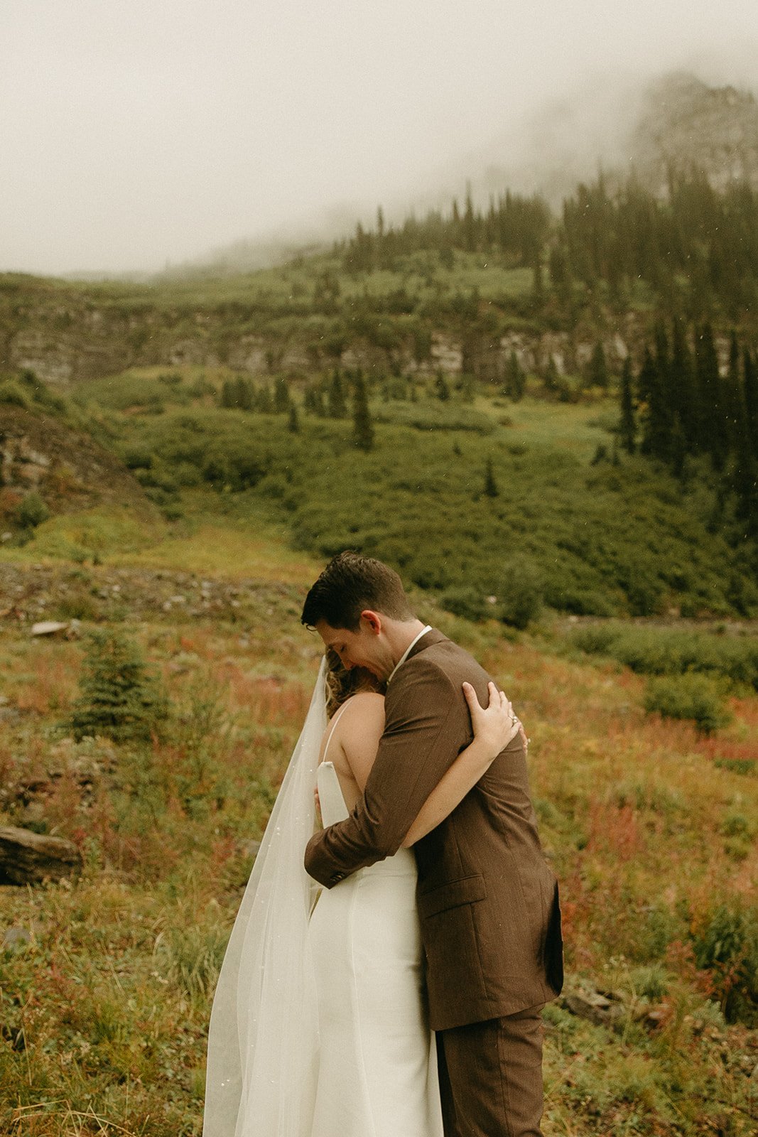 Bride and groom hugging in the Montana Mountains