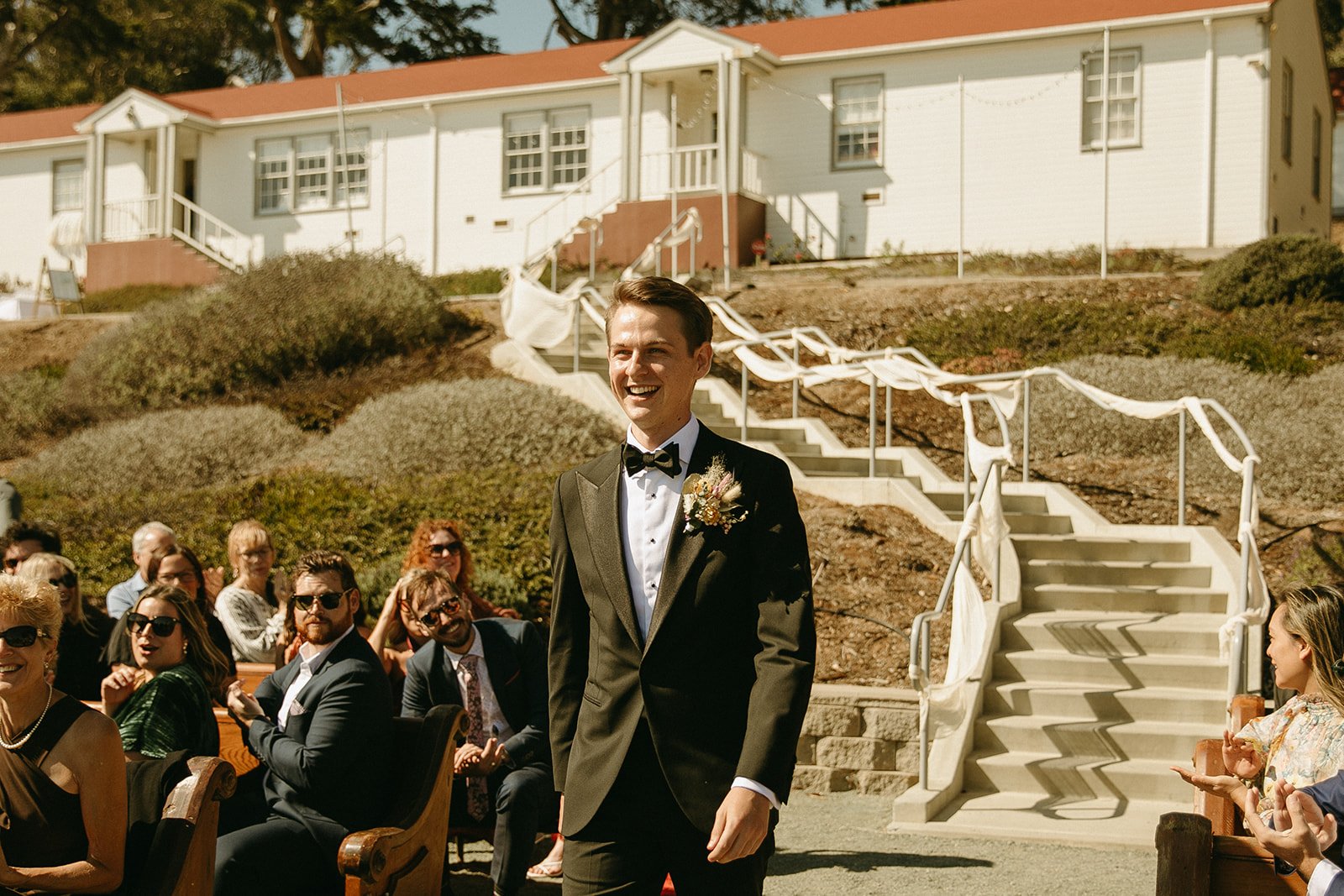 Groom walking down the aisle at Point San Luis Lighthouse
