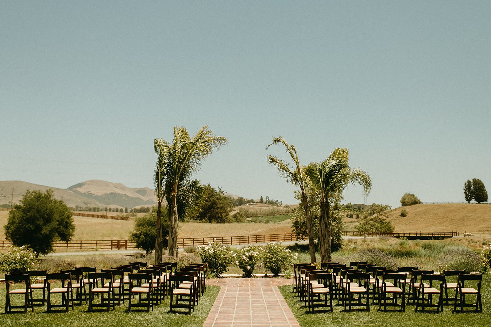 Outdoor San Luis Obispo Wedding day with a white wedding decor and florals