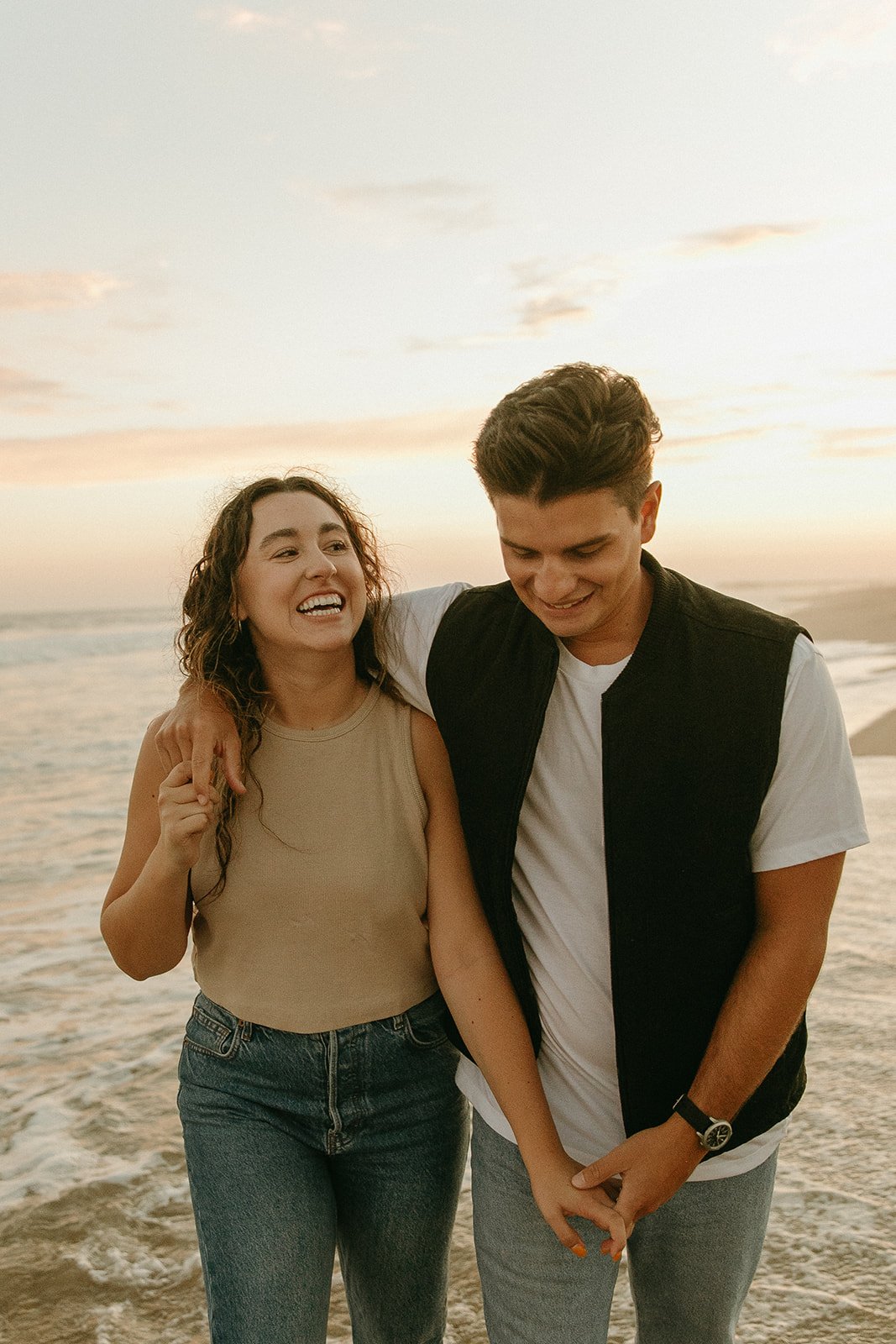 Newport Beach engagement photo session with cute couple during golden hour