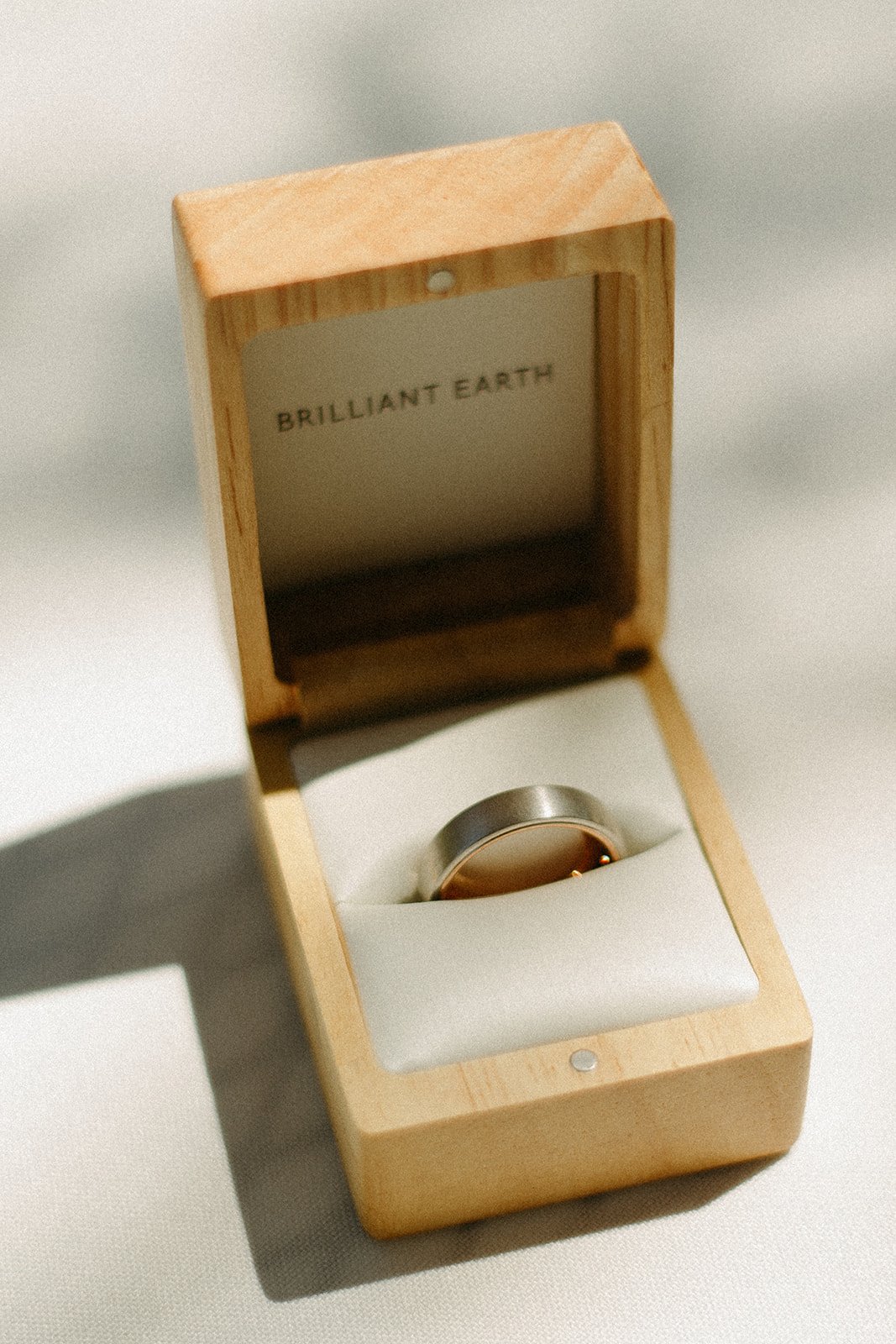 Groom wedding ring in a wooden box