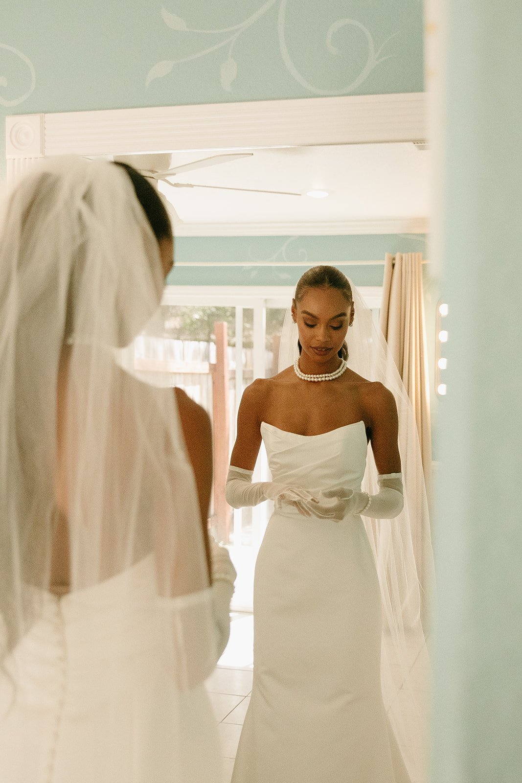 Bride getting ready in a strapless wedding dress