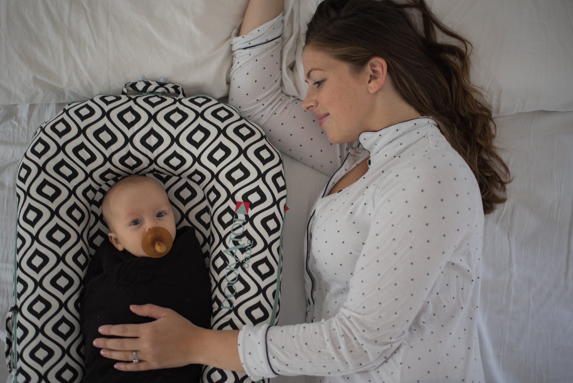The Dock-A-Tot is the perfect little space for baby and helps parents have a way to calm and transfer baby from co-sleeping to their own crib.