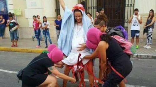 Sick "Feminists" stage bloody fake abortion on woman dressed as Virgin Mary