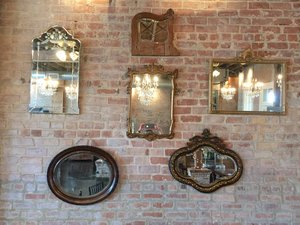 Exposed brick walls with antique mirrors.jpg