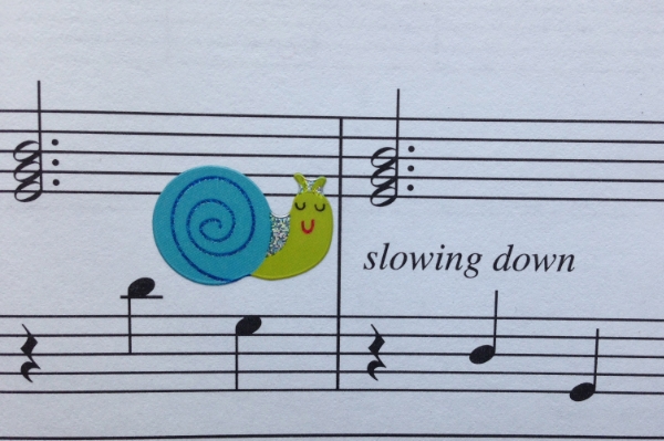 Why would this particular sticker help a student remember to play slower here?