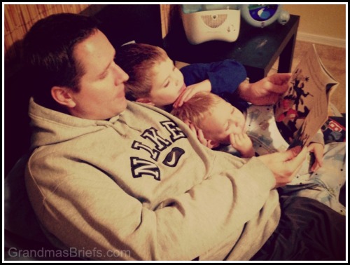 dad reading to sons