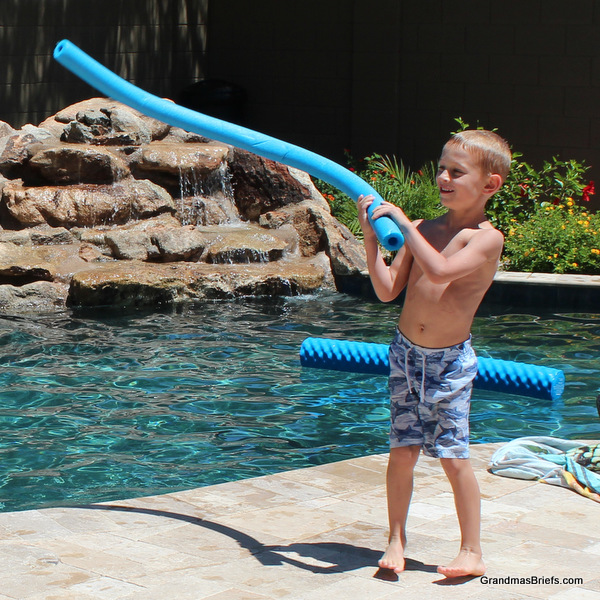 six year old and pool noodle