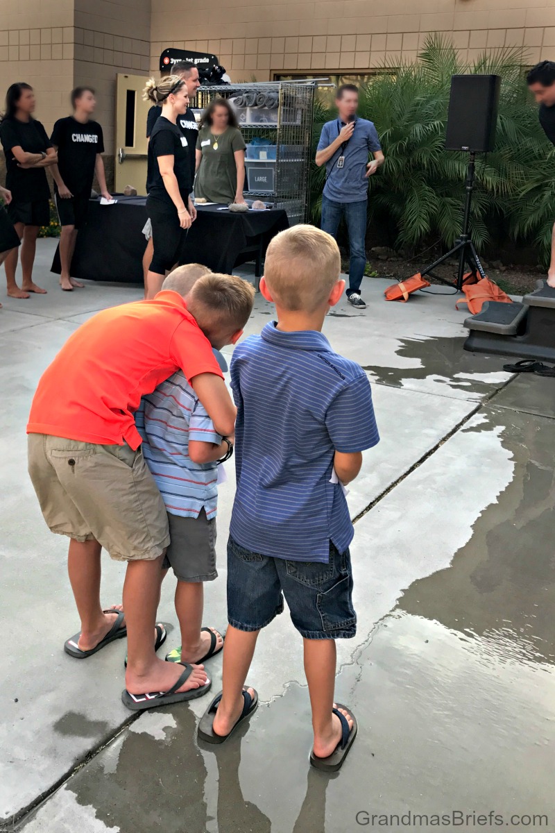 boys watch Mom and Dad get baptized