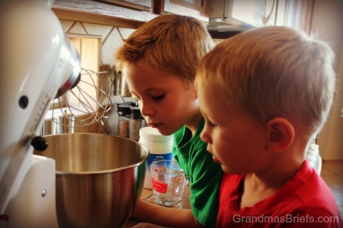 kids looking in mixer bowl