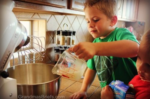 boy pouring ingredients