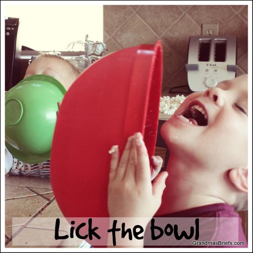 boys licking baking bowls