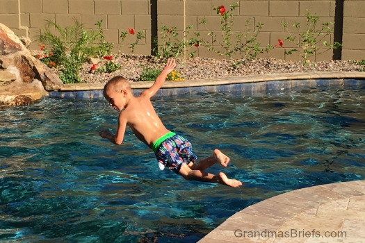 boy dives in pool
