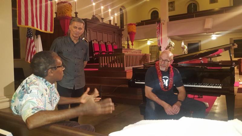 Being introduced to a new friend by my buddy, Pastor Rojo (standing) in Honolulu