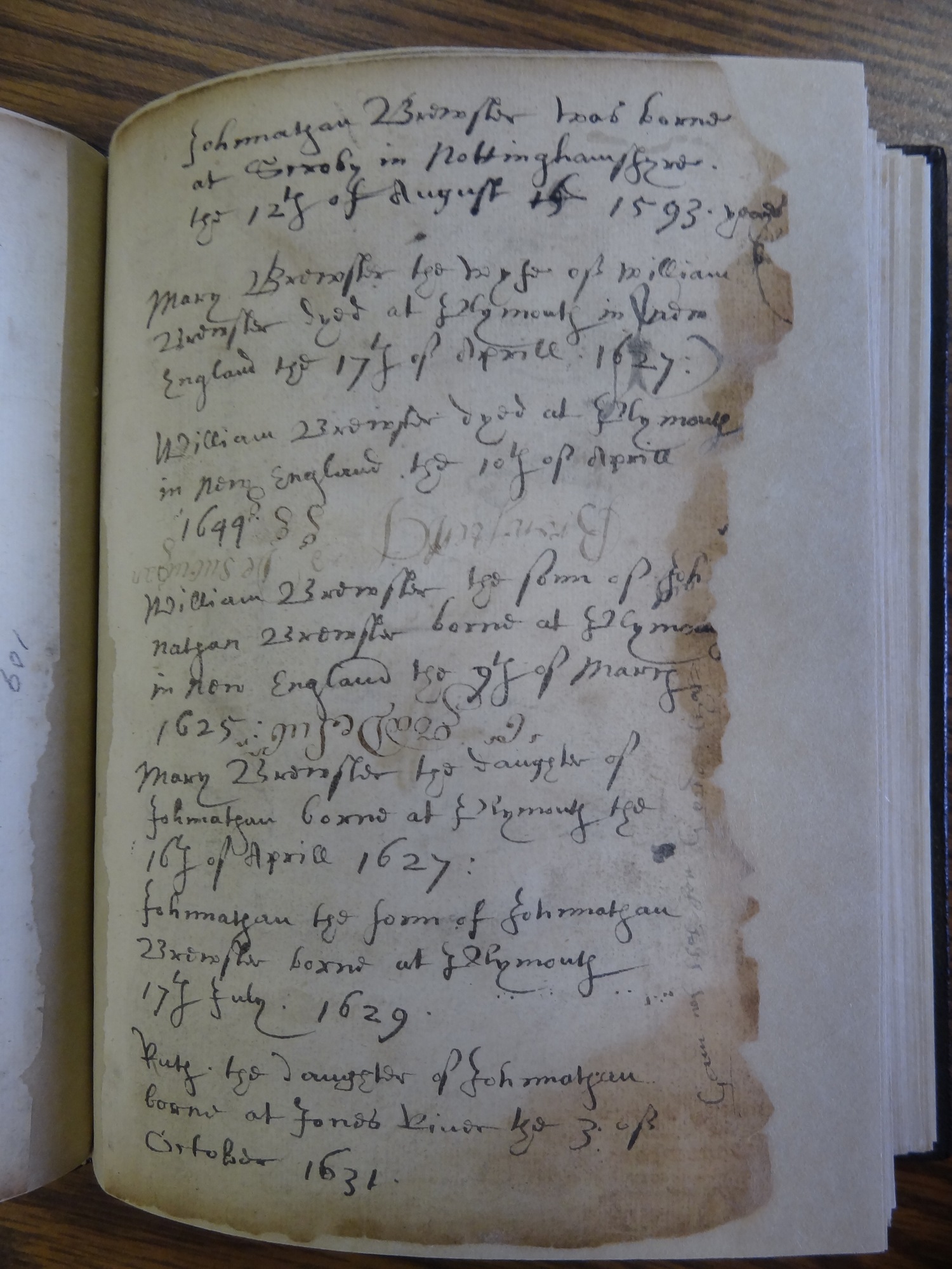  A page from the "Brewster Book," containing some of the family birth and death records for William and Mary Brewster and their children. 