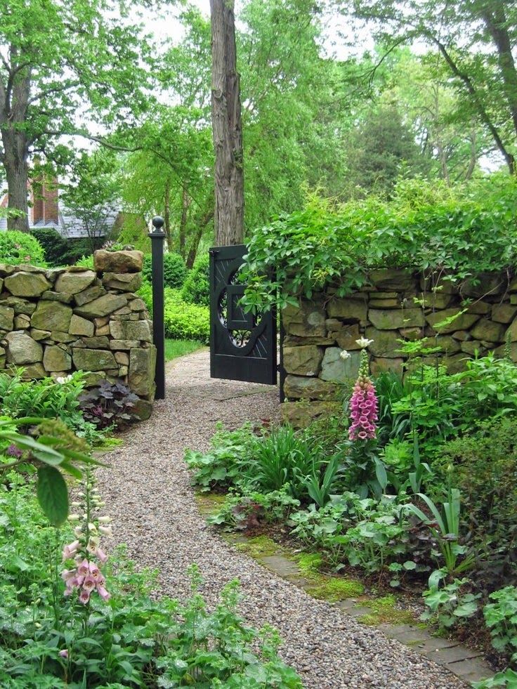 Stone walls pea gravel path. ~ Style Estate - 15 Gorgeous Garden Gates