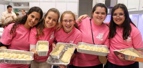 Click photo to download. Caption: Challah baking in Miami for The Shabbat Project in 2014. Credit: The Shabbat Project.