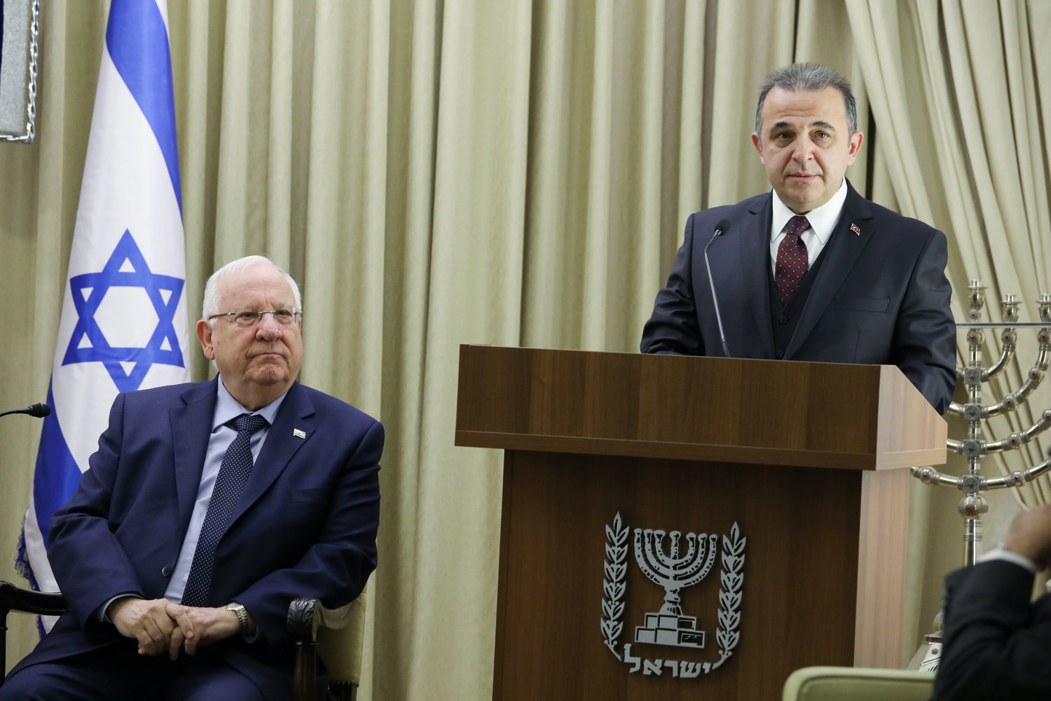 Israeli President Reuven Rivlin (left) looks on as incoming Turkish Ambassador to Israel Kemal Okem speaks during a ceremony for new ambassadors at the President's Residence in Jerusalem