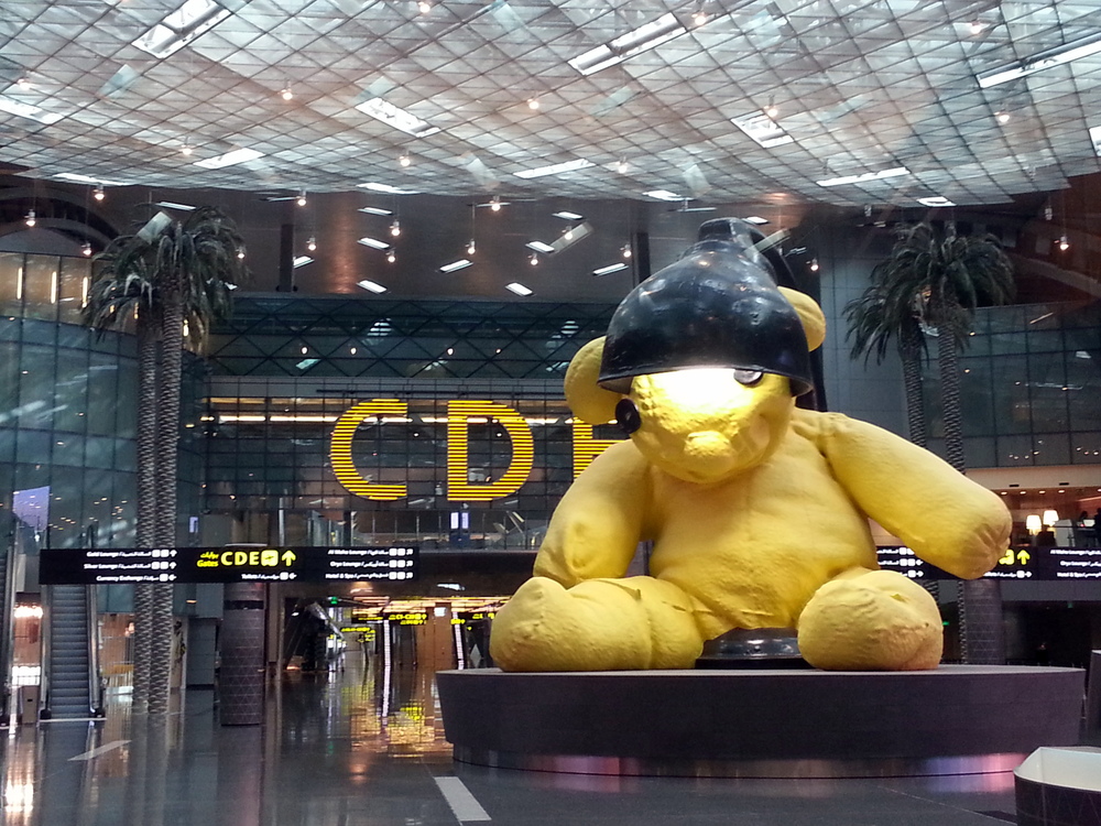 Image result for big yellow teddy bear qatar airport