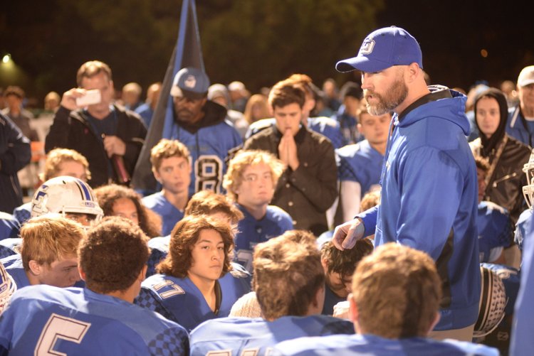  Volt coach Tyler Hales talks to his football team at La Jolla Country Day high school in California. 